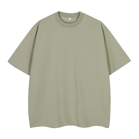 Moss green short-sleeve cotton t-shirt with a crew neck and a relaxed, oversized fit. - Image 8