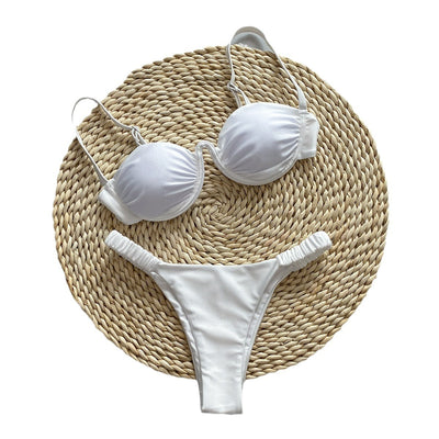 Rust underwire bikini set with ruched top and high-cut bottom, displayed on a woven mat. - Image 5