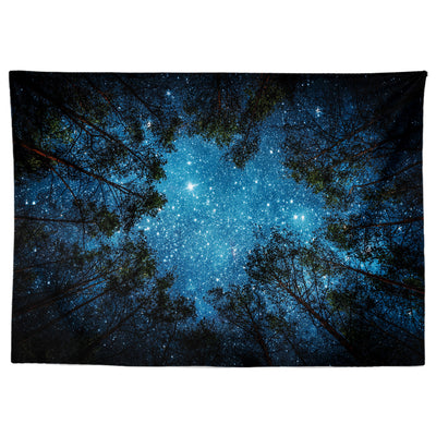 Wall tapestry featuring a vibrant starry night sky seen through the dark silhouettes of tall forest trees. - Image 2