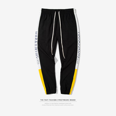 Pantalones Casuales Elásticos para Hombre con Rayas Laterales y Letras de Primavera - Image 4