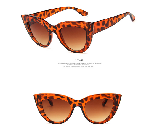 White and black cat eye sunglasses with gradient lenses, featuring a retro style. - Image 12