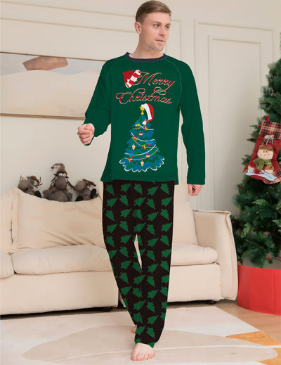 Family of four wearing matching green Christmas pajamas with "Merry Christmas" text and tree graphics. - Image 10