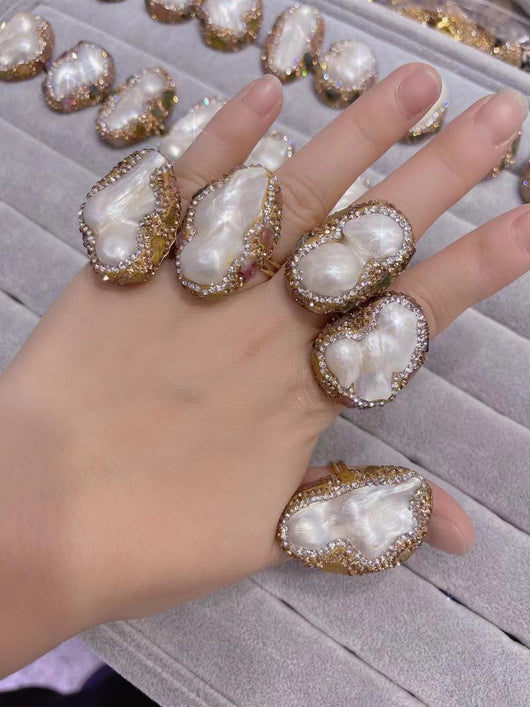 Baroque pearl necklace, ring, earrings, and bracelet set with gold-toned settings and sparkling accents. - Image 9