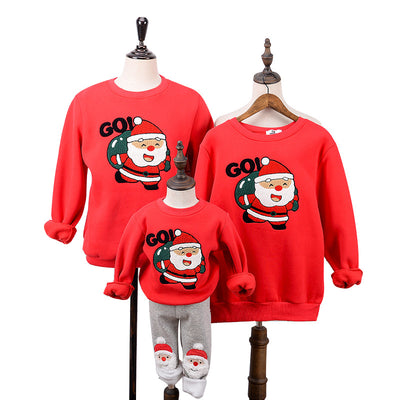 Red parent-child Christmas sweaters with a cartoon Santa Claus graphic, displayed on adult and child mannequins. - Image 12