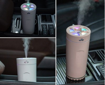 Gray cylindrical USB aromatherapy humidifier with a silver band and car icon on top, designed for car use. - Image 16