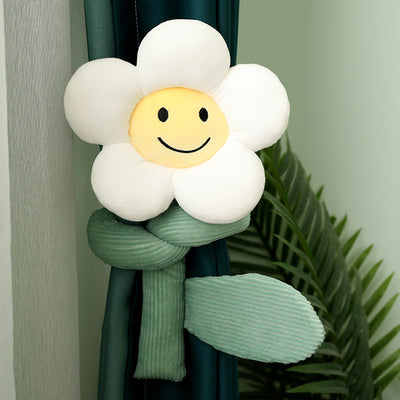 Plush white sunflower curtain buckle with a yellow smiley face center and green stem, holding back a dark green curtain. - Image 3