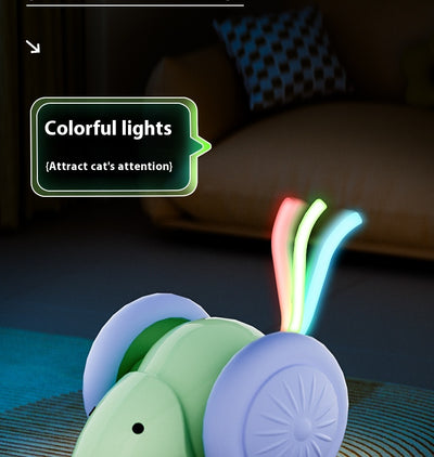 Green and purple electric mouse car cat toy with a glowing tail on a woven mat, designed for interactive play. - Image 13