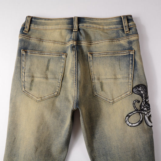 Jeans Slim Fit Desgastados con Bordado de Serpiente de Tres Cabezas y Parches de Cuero - Image 8