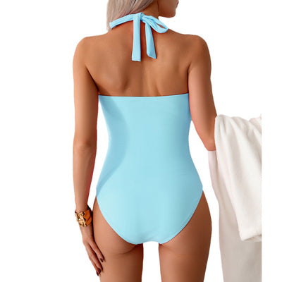 Women's pink one-piece swimsuit with a halter neck, twisted front detail, and ruched sides. - Image 5