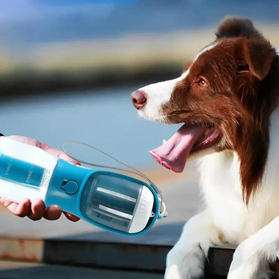 Purple 3-in-1 portable pet water bottle with food compartment, waste bag dispenser, and lanyard. - Image 6