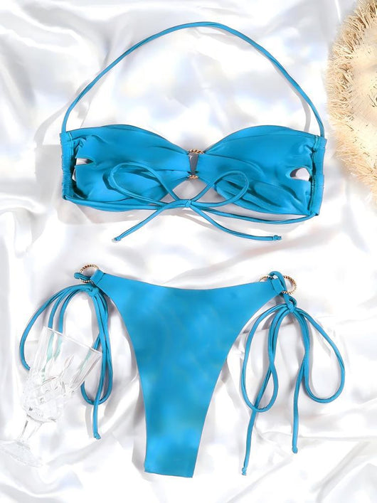 Women's brown lace-up halter bikini suit with ruched top and gold-tone ring details, modeled outdoors. - Image 10