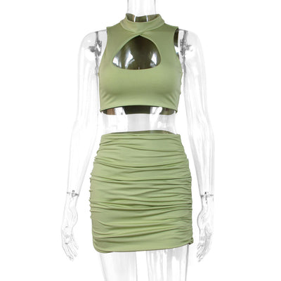 Light green two-piece set featuring a sleeveless crop top with a high neck and chest cutout, paired with a ruched bodycon mini skirt. - Image 5