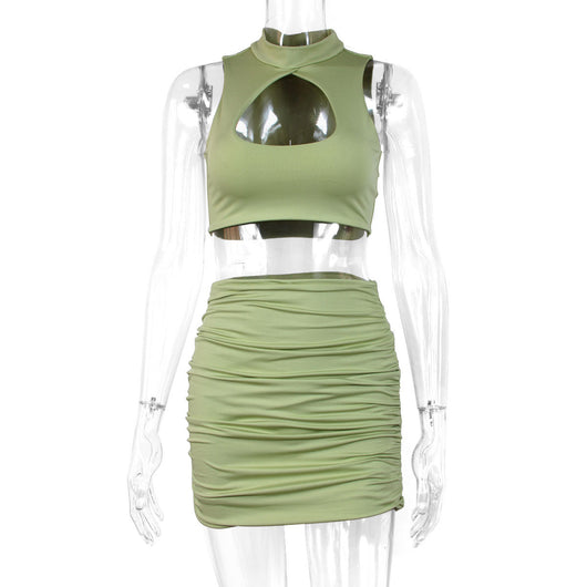 Light green two-piece set featuring a sleeveless crop top with a high neck and chest cutout, paired with a ruched bodycon mini skirt. - Image 5