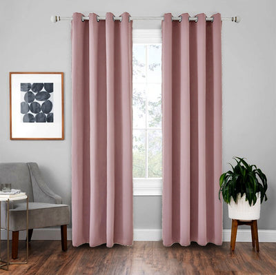 Light gray polyester blackout curtains with grommet tops hanging on a white rod in a modern living room. - Image 14