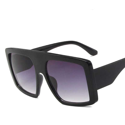 Large frame sunglasses with a brown and pink gradient full frame and brown gradient lenses.