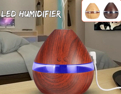 Light wood grain teardrop ultrasonic humidifier and essential oil diffuser with a clear LED light band. - Image 5