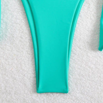 Black two-piece swimsuit with a halter triangle top and high-cut tie-side bottoms featuring gold-tone rings. - Image 22