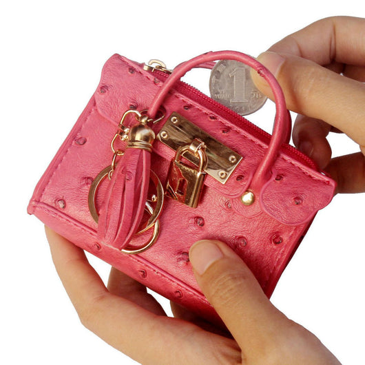 Bolso de Mano Minimalista en Cuero con Borlas