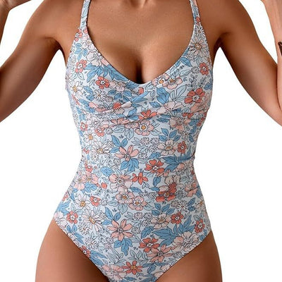 Women's black and white one-piece swimsuit with a twisted halter top and ruched detailing on the bottom. - Image 3