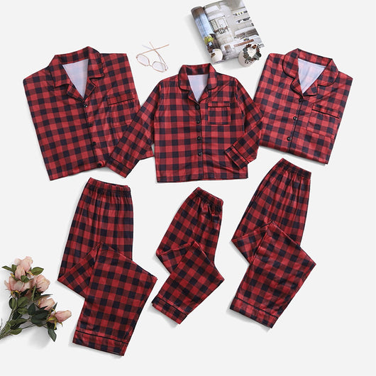 Three dark blue family pajama sets with white and light blue snowflake patterns, featuring long-sleeve tops and pants. - Image 33