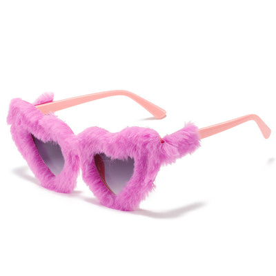 Pink plush heart-shaped sunglasses with light pink tinted lenses and matching pink plastic temples. - Image 17