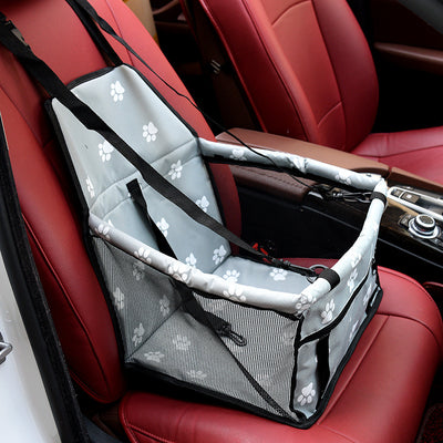 Light grey pet car booster seat with black mesh sides and adjustable straps, installed on a black and red car seat. - Image 14