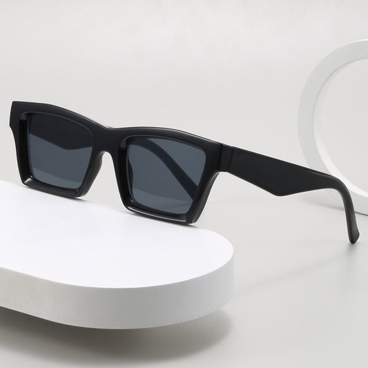 Champagne translucent rectangular sunglasses with brown lenses, featuring a simple fashion design.
