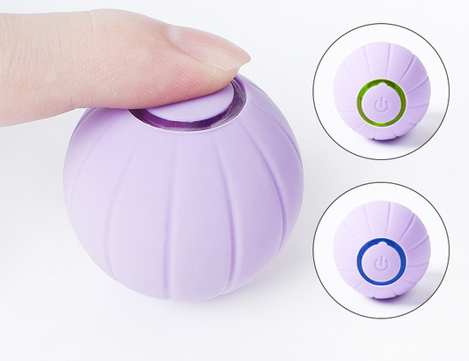 Orange smart bouncing rolling silicone ball toy for cats, shown with its white packaging box and a white USB charging cable. - Image 8