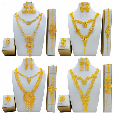Gold-colored fashion jewelry set with a two-layer necklace, drop earrings, bracelet, and ring, all featuring intricate leaf and floral filigree designs. - Image 10