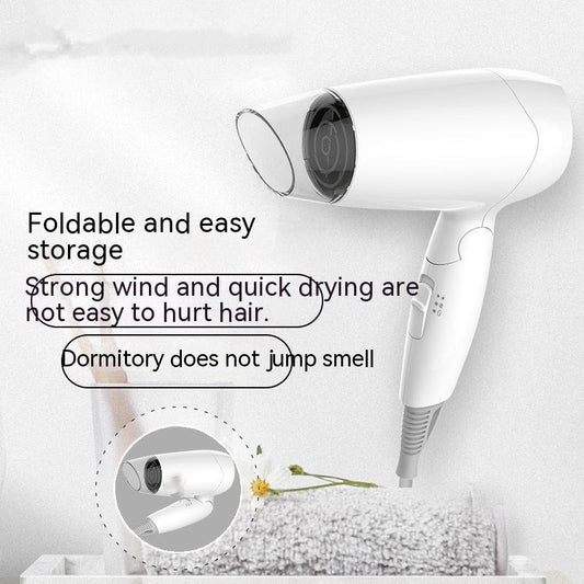 White compact hair dryer with a clear nozzle and control buttons on the handle, ideal for household or travel use.