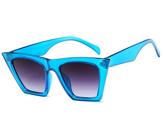 Transparent nude cat-eye sunglasses with brown gradient lenses, featuring a vintage 90s fashion style for women. - Image 3