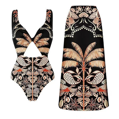 Black one-piece swimsuit with an asymmetrical top and matching long skirt, featuring a tropical palm tree and bird print. - Image 8