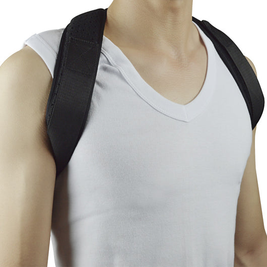 Black back shoulder spine posture corrector worn over a white long-sleeved shirt, showing adjustable straps. (2 pcs) - Image 9