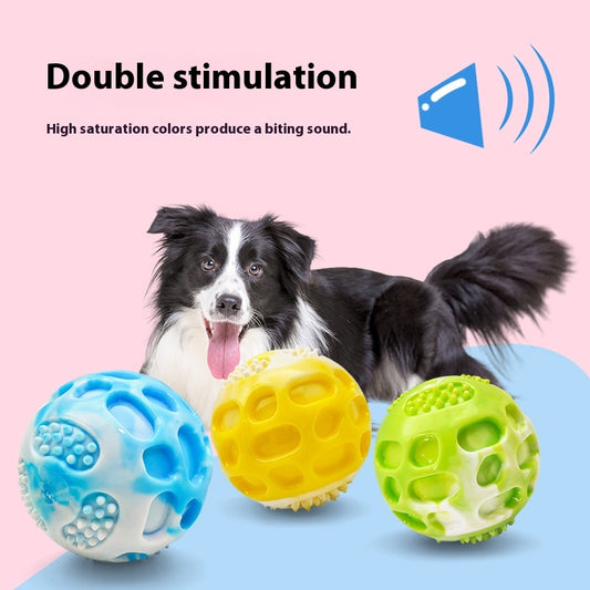 Blue and white marbled rubber dog toy ball with textured nubs and hollows, approximately 6cm in diameter.