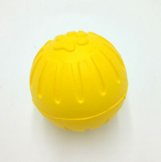 Bright yellow EVA pet ball dog toy with textured grooves and paw print details for interactive play. - Image 14