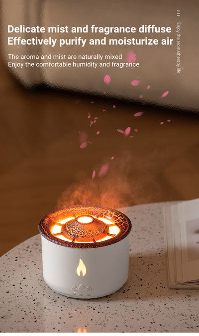 White ultrasonic essential oil diffuser with orange flame effect mist, alongside a gift set of Lavender, Peppermint, Tea Tree, and Sweet Orange essential oils. - Image 14