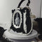 Bolso Vintage Estilo Periódico en Blanco y Negro