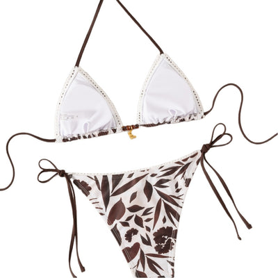 Brown and white floral print triangle bikini with tie-side bottoms and a small gold pendant detail. - Image 5