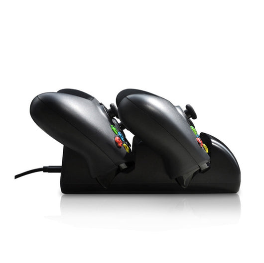 Black dual charging dock for Xbox One wireless controllers with an LED display, shown with two black controllers. - Image 6