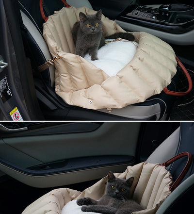 Light khaki quilted portable pet carrier with brown handles and a cream shoulder strap for car travel. - Image 10