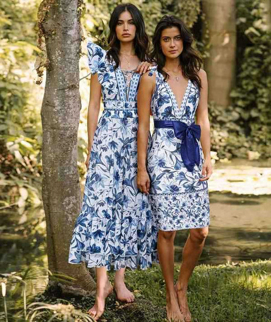 Women's blue and white floral one-piece swimsuit with ruffled V-neck and matching sarong skirt with bow. - Image 25