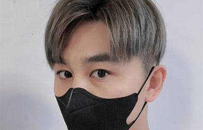 Peach disposable 3-layer face mask with perforated details worn by a person, offering comfortable daily protection. - Image 27