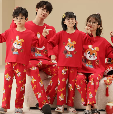 Family of four wearing matching yellow long-sleeved cotton pajamas with a cute panda design and "HUG ME!" text.