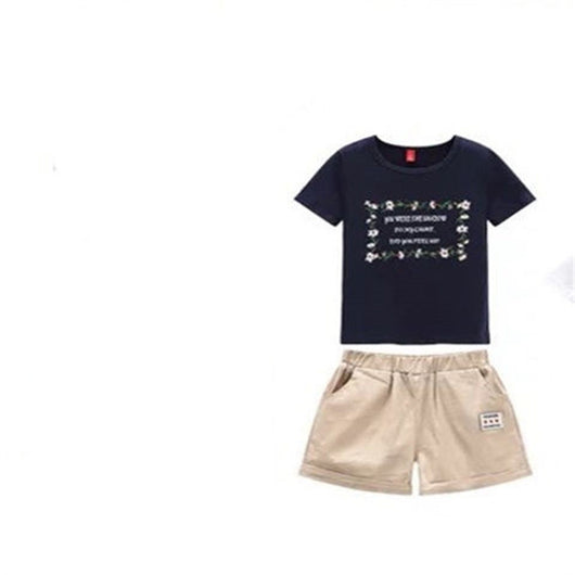 Navy blue short-sleeve t-shirt with a white floral-framed text print paired with light beige elastic-waist shorts. - Image 3