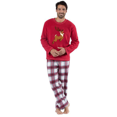 Family of five and a dog wearing matching red long-sleeve reindeer print tops and red and white plaid pajama pants. - Image 15