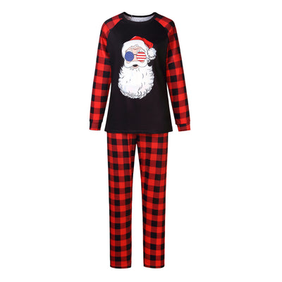 Christmas pajama set with a black long-sleeve top featuring a Santa head in American flag sunglasses and red and black buffalo plaid pants. - Image 15