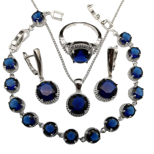 Four-piece silver-tone jewelry set with round green gemstones, including a necklace, bracelet, ring, and dangle earrings. - Image 5