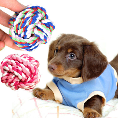 Pink and white braided cotton rope ball pet toy for dogs, designed for chewing and play. - Image 4