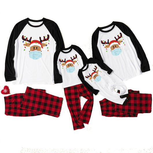 Matching family Christmas pajamas with grey tops, red plaid sleeves, and a reindeer wearing a Santa hat and face mask. - Image 8