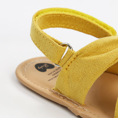 Black baby sandals with knotted cross straps and a matching black floral headband on a white background. - Image 23